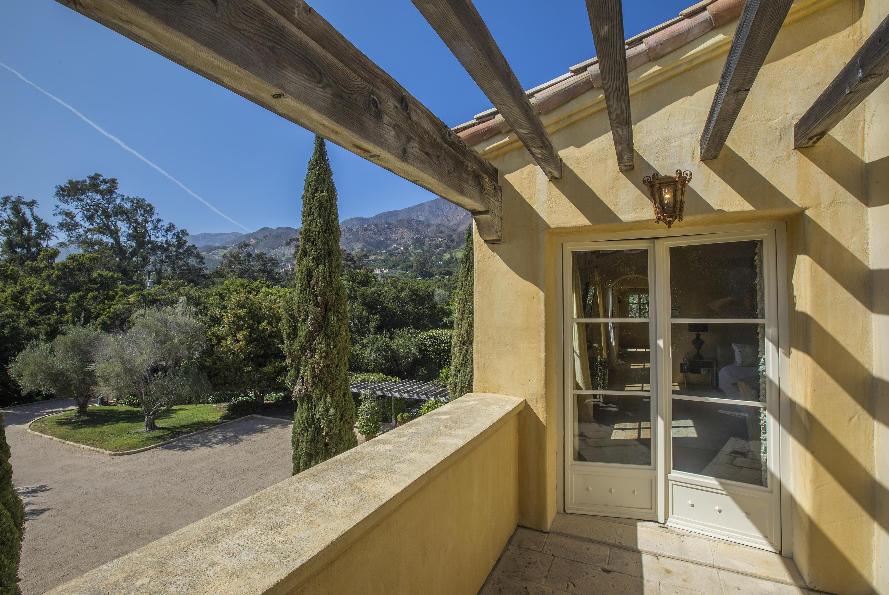 1525 Las Tunas Road Montecito, CA 93108 - Photo 13 of 28 a view of a balcony with chair and tables