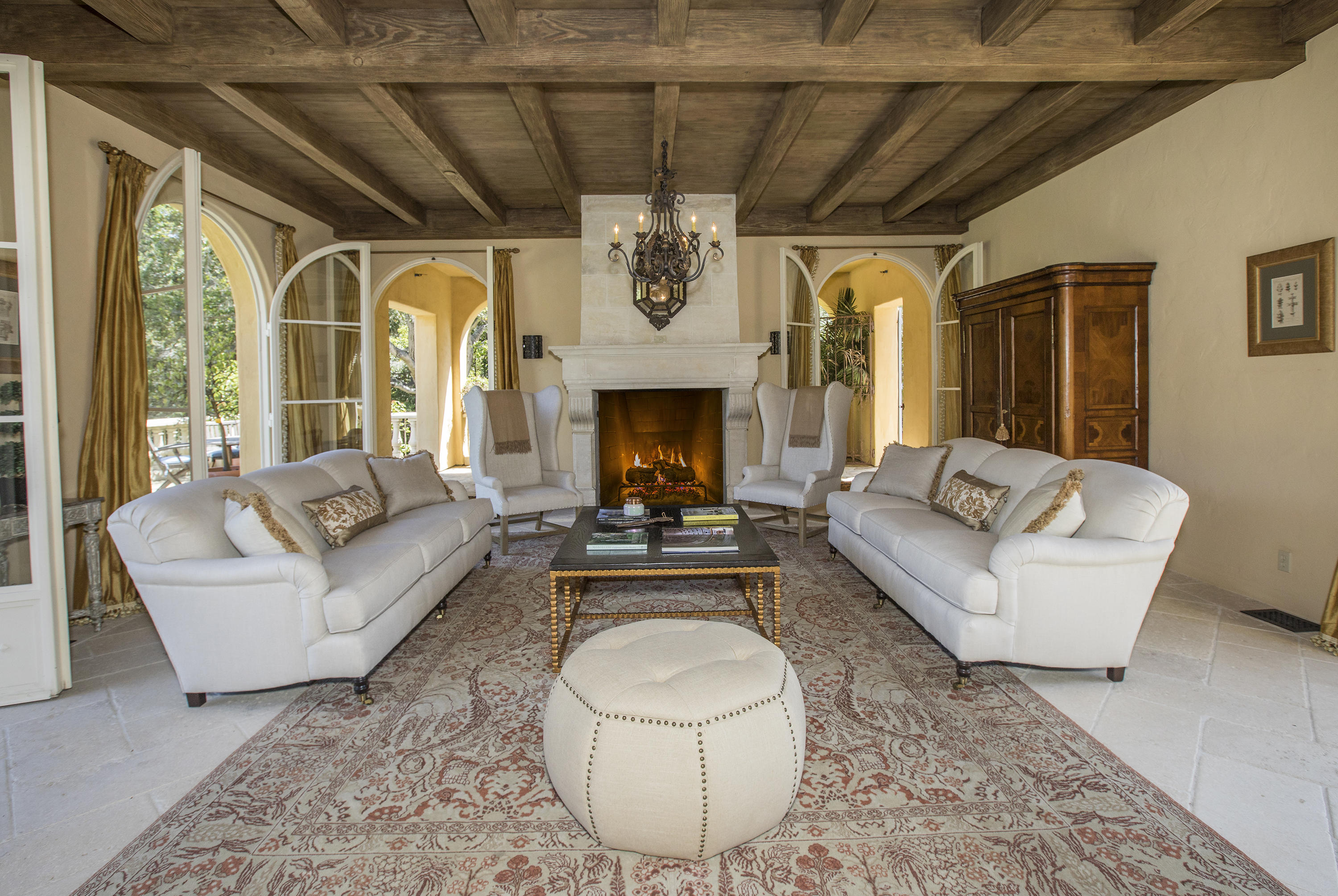 1525 Las Tunas Road Montecito, CA 93108 - Photo 3 of 28 a living room with furniture a fireplace and a chandelier