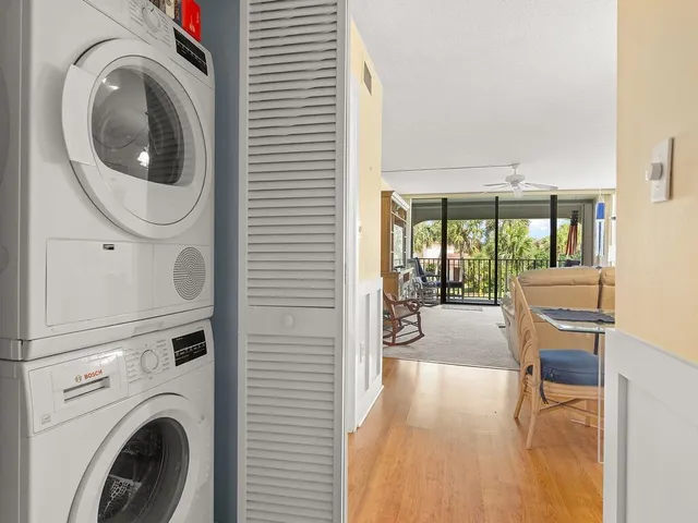 a view of a hallway with washer and dryer