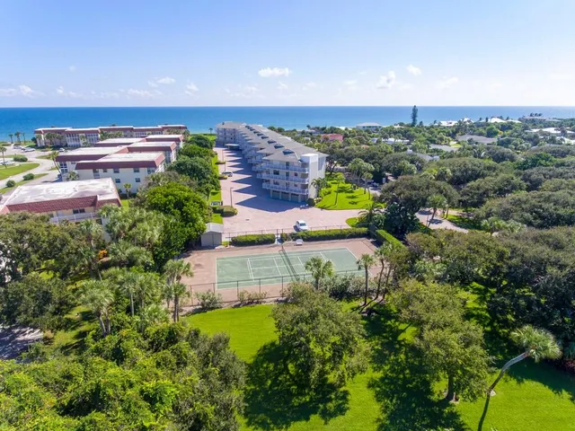 an aerial view of a house with a garden