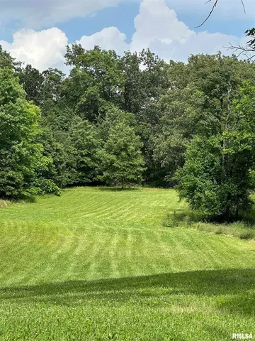 a view of a field with an outdoor space