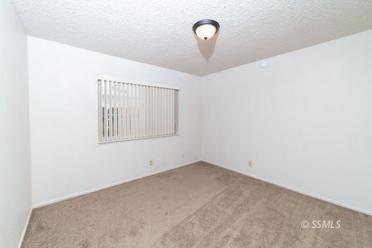 405 South Fountain Street Ridgecrest, CA 93555 - Photo 12 of 24 an empty room with windows