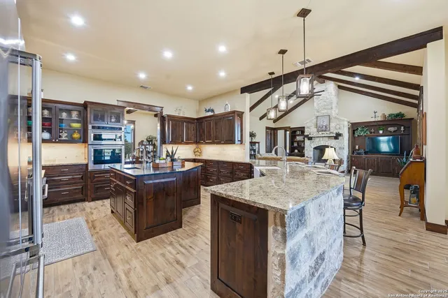 a kitchen with sink a stove and cabinets