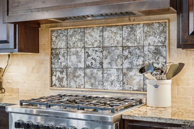 a bathroom with a granite countertop double vanity and a sink
