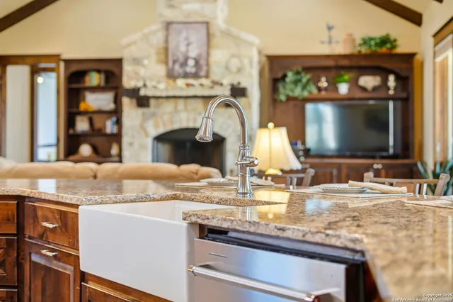 a kitchen with a stove and a sink