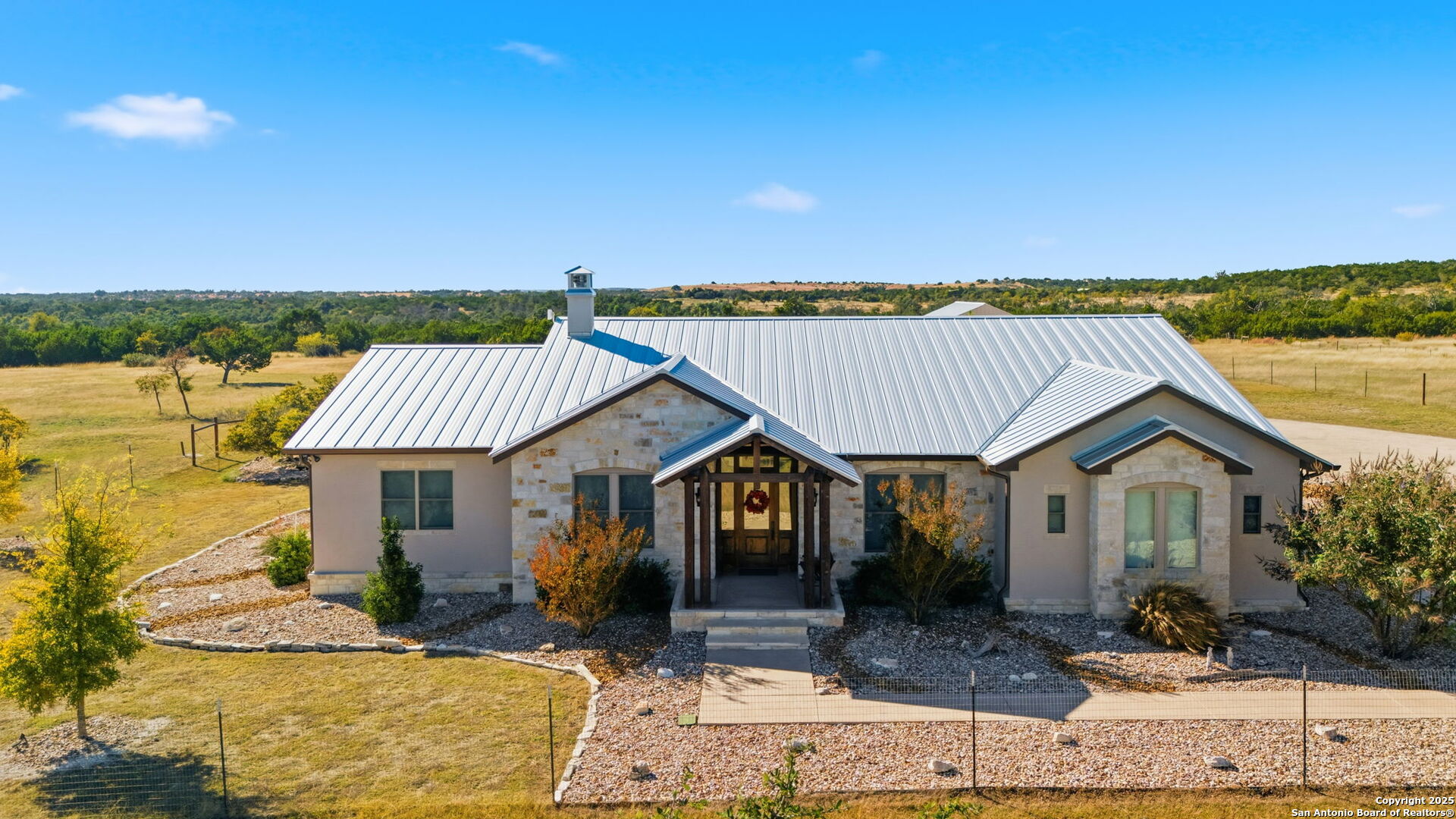 601 Garrison Road Fredericksburg, TX 78624 - Photo 2 of 77 a front view of a house with a yard