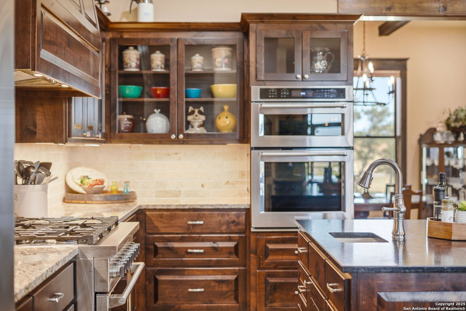 601 Garrison Road Fredericksburg, TX 78624 - Photo 21 of 77 a kitchen with a stove and a sink