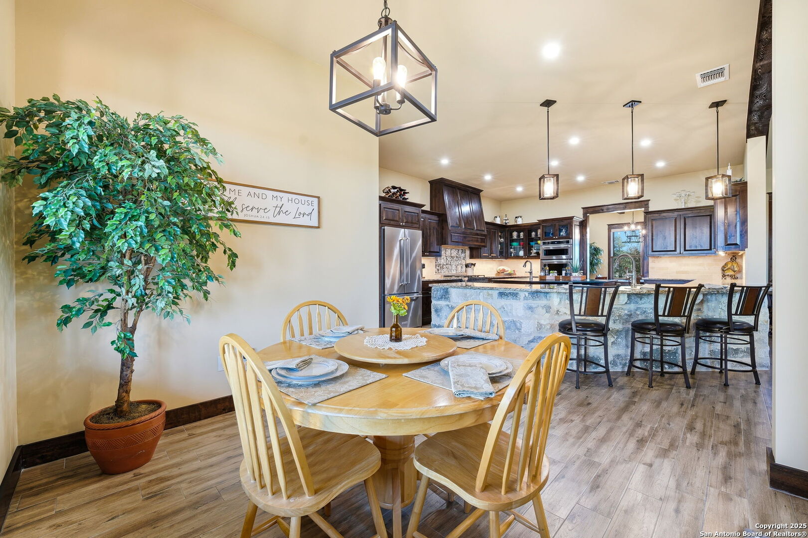 601 Garrison Road Fredericksburg, TX 78624 - Photo 22 of 77 a dining room with furniture and wooden floor