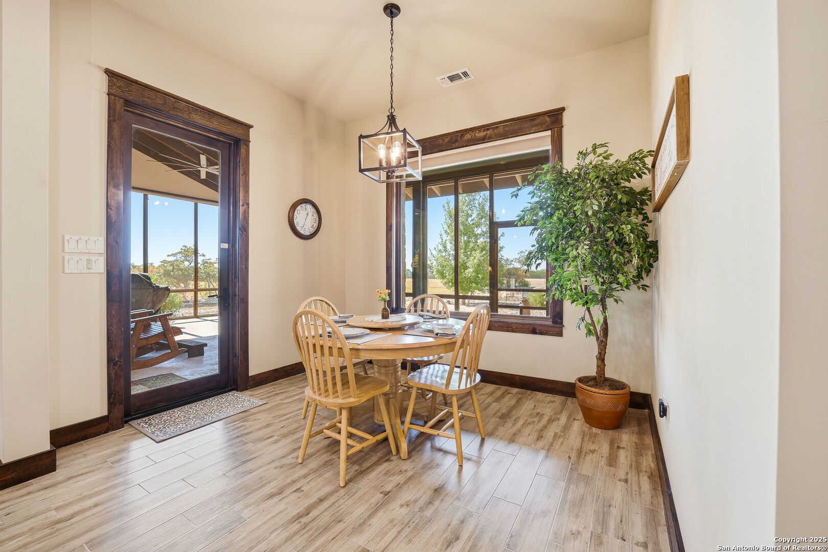 601 Garrison Road Fredericksburg, TX 78624 - Photo 23 of 77 a view of a dining room with furniture window and wooden floor