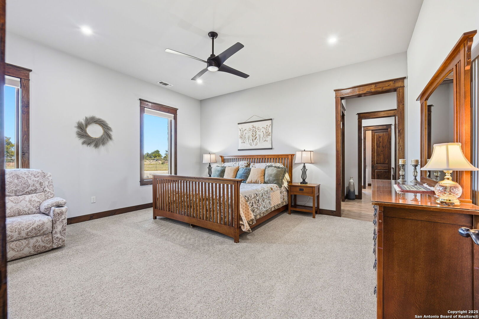 601 Garrison Road Fredericksburg, TX 78624 - Photo 24 of 77 a bedroom with a bed couch and window