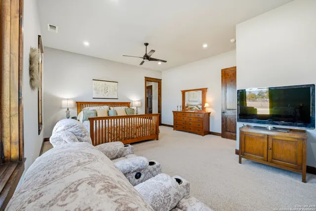 a spacious bathroom with a bathtub and a sink