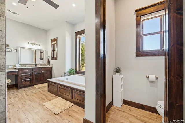 a bathroom with a shower and a sink