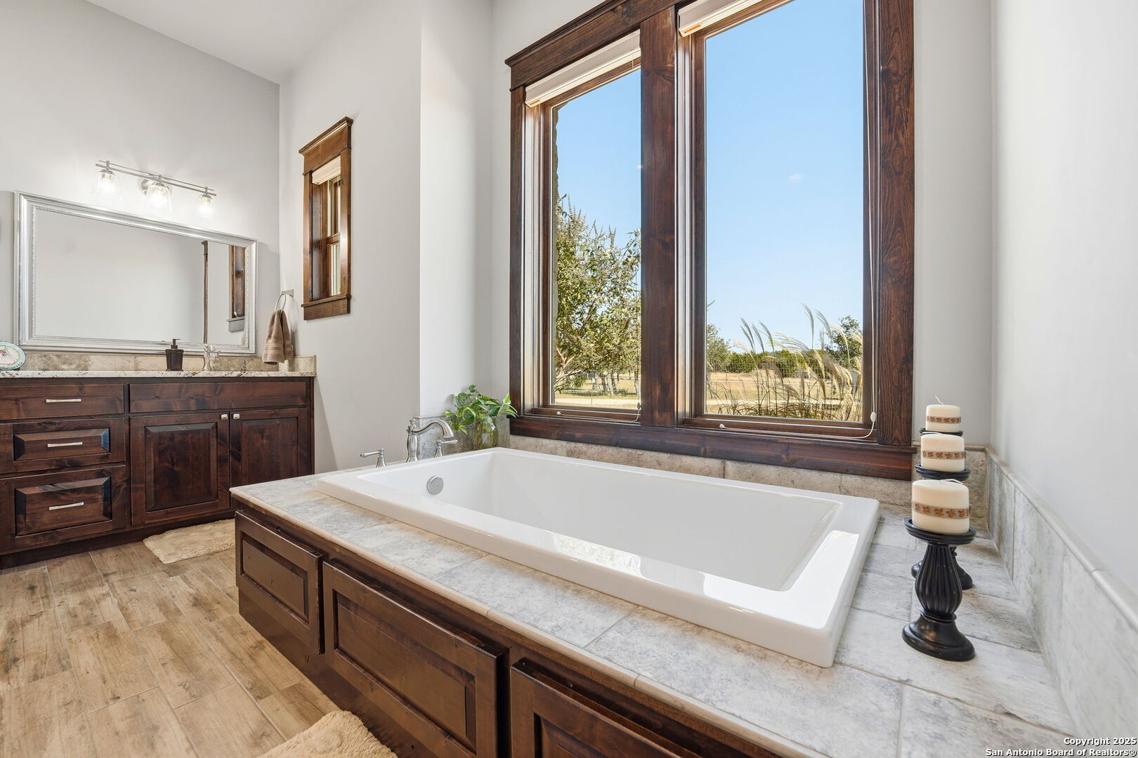 601 Garrison Road Fredericksburg, TX 78624 - Photo 29 of 77 a spacious bathroom with a bathtub and a sink