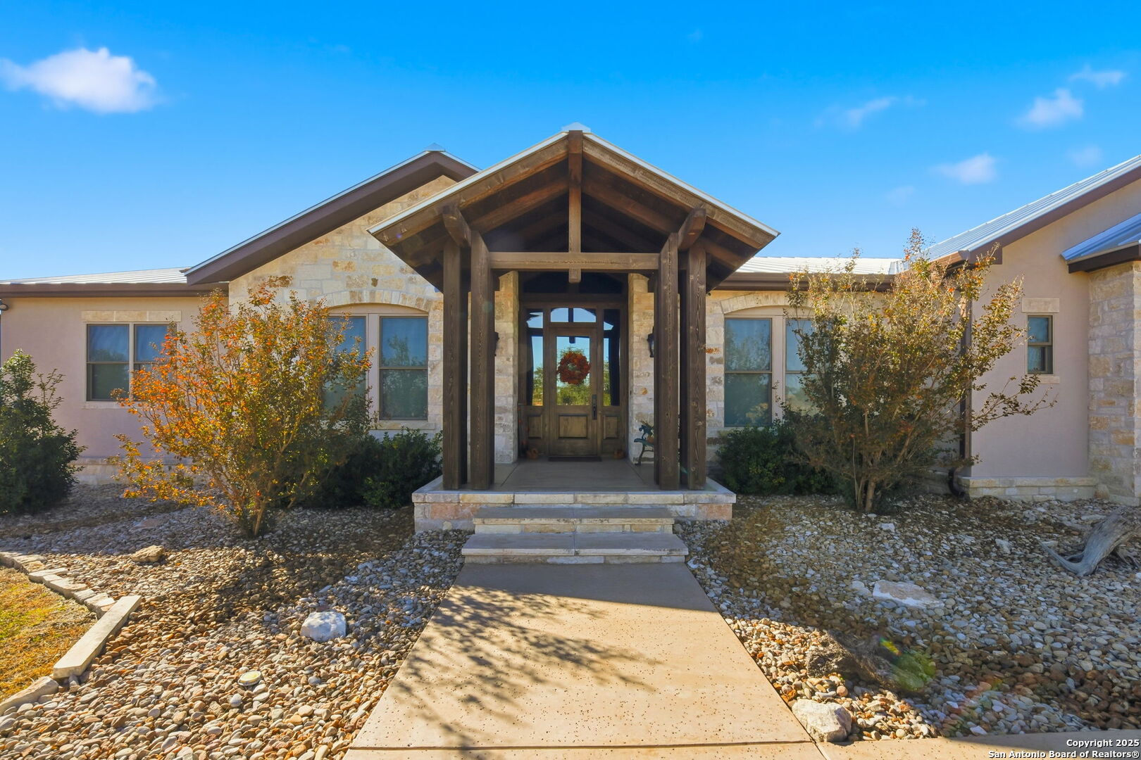 601 Garrison Road Fredericksburg, TX 78624 - Photo 3 of 77 a front view of a house with garden