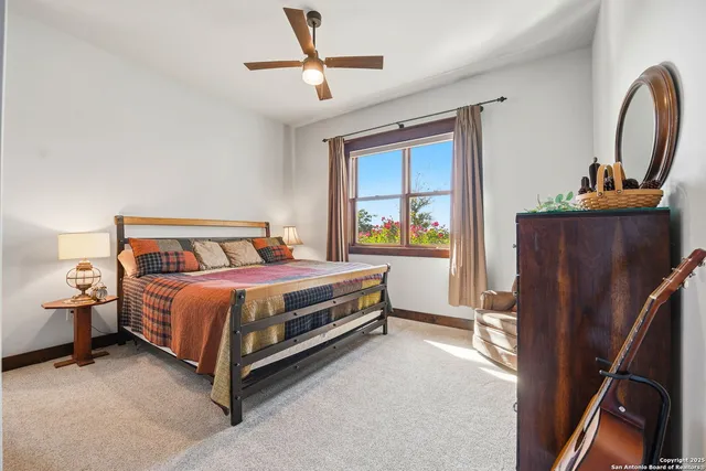 a view of a livingroom with workspace and a window