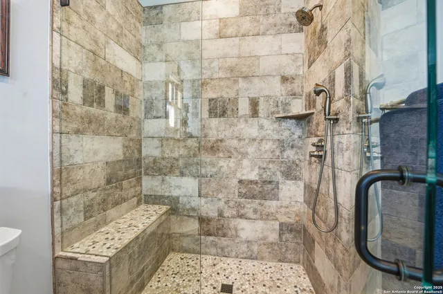 a utility room with stainless steel appliances granite countertop a sink and a stove