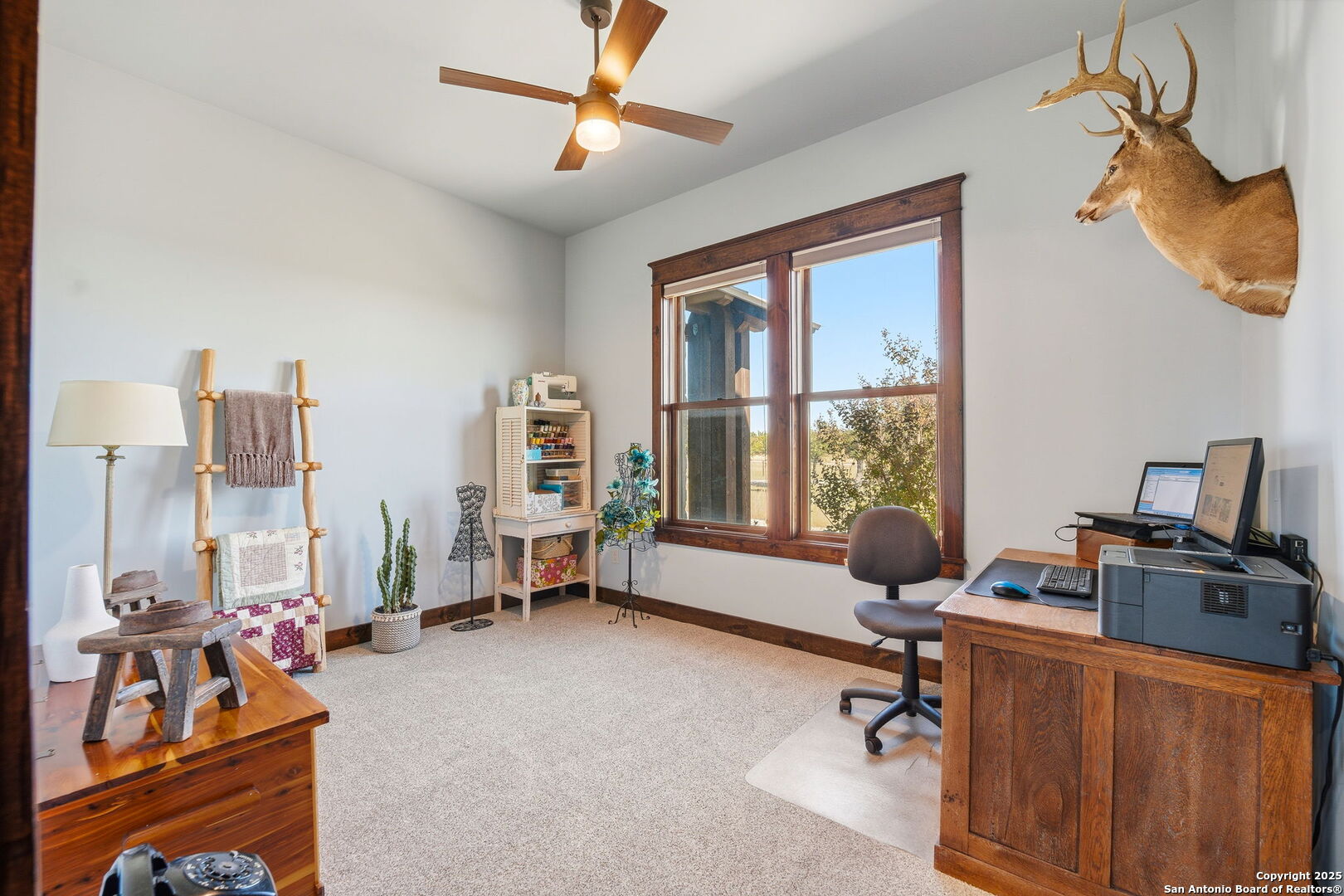 601 Garrison Road Fredericksburg, TX 78624 - Photo 39 of 77 a view of a livingroom with workspace and a window