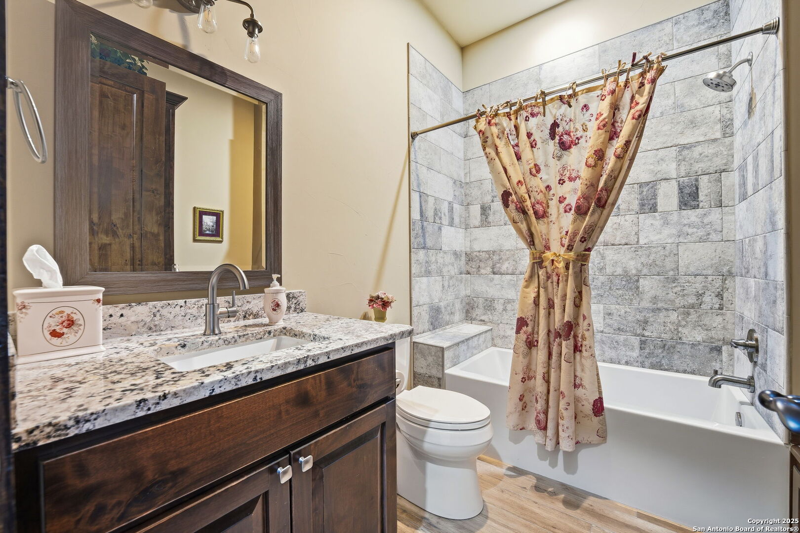 601 Garrison Road Fredericksburg, TX 78624 - Photo 41 of 77 a bathroom with a granite countertop sink and a mirror