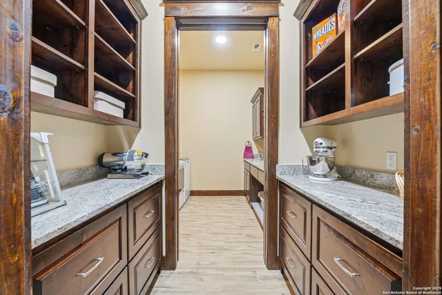 a view of a big yard with an ocean view