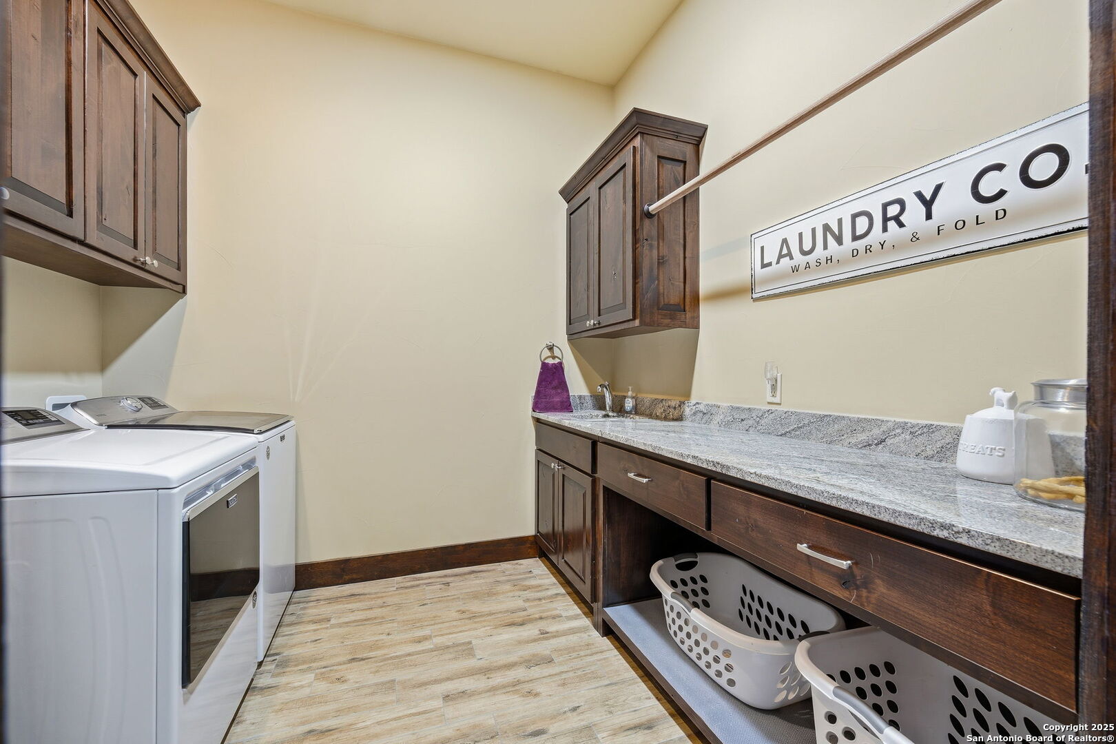 601 Garrison Road Fredericksburg, TX 78624 - Photo 44 of 77 a utility room with stainless steel appliances granite countertop a sink and a stove