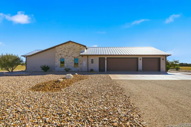 a aerial view of a house with pool lake view and mountain view