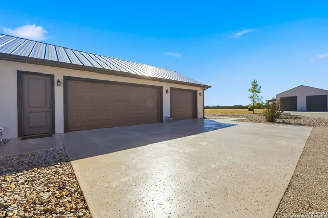 an aerial view of a house with outdoor space