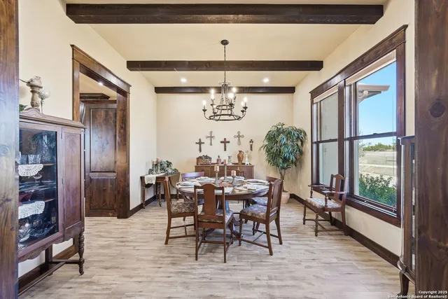 a living room with fireplace furniture and a wooden floor