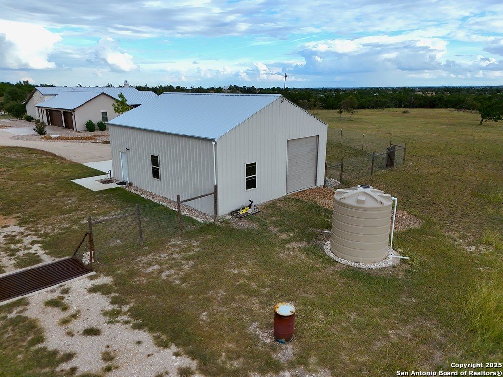 601 Garrison Road Fredericksburg, TX 78624 - Photo 62 of 77 a view of a house with a yard