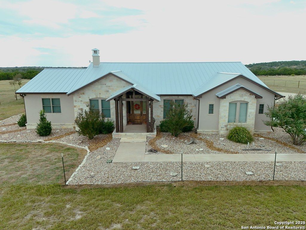 601 Garrison Road Fredericksburg, TX 78624 - Photo 65 of 77 a front view of a house with a yard