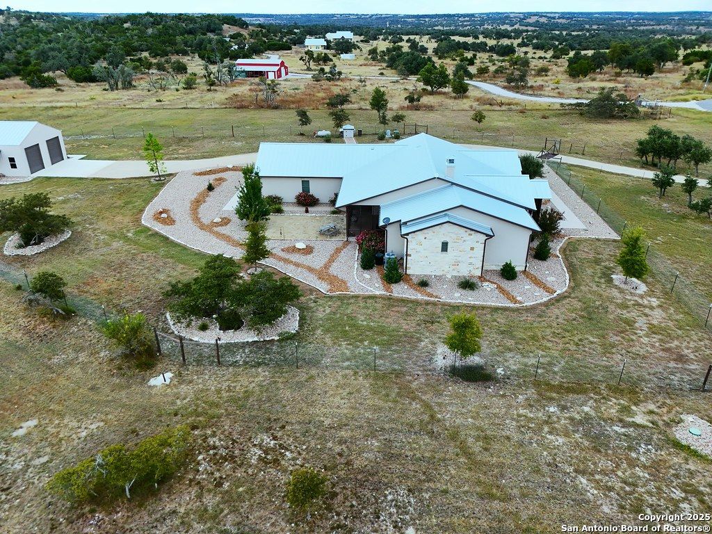 601 Garrison Road Fredericksburg, TX 78624 - Photo 68 of 77 an aerial view of a house with outdoor space