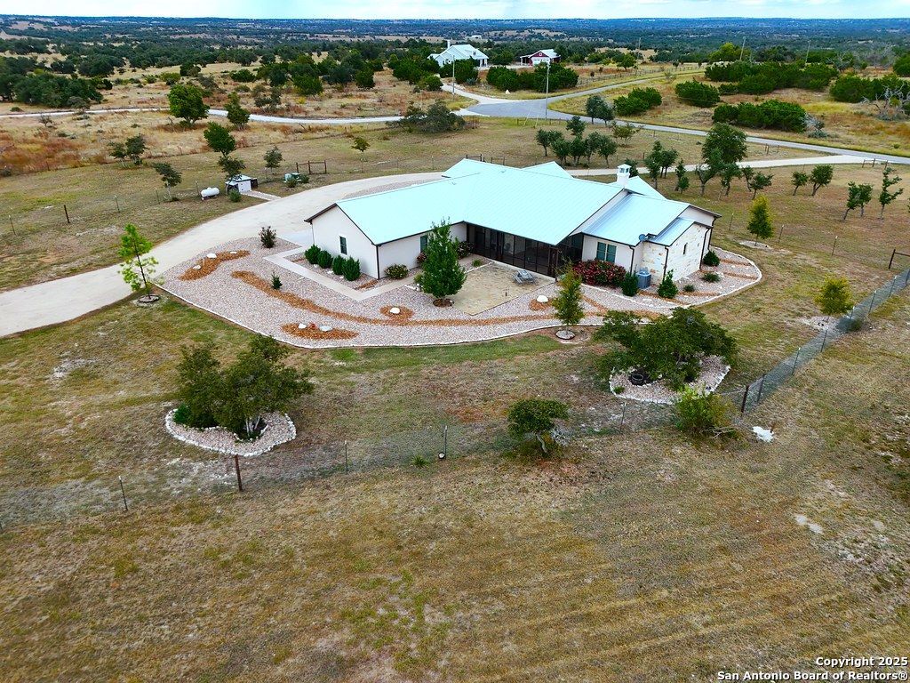 601 Garrison Road Fredericksburg, TX 78624 - Photo 71 of 77 an aerial view of a house with yard swimming pool and outdoor seating