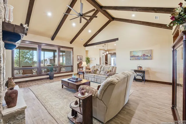 a living room with furniture and a fireplace