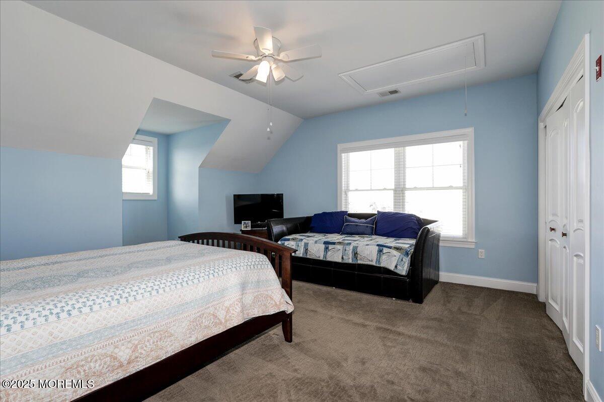 1874 Compass Court Toms River, NJ 08753 - Photo 12 of 12 a bedroom with a bed and a chandelier