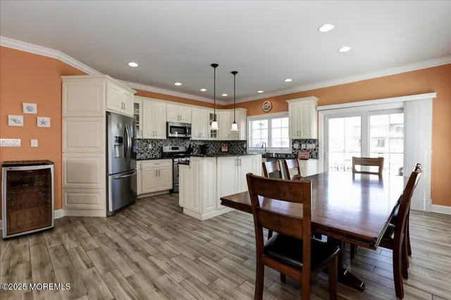 a backyard of a house with wooden floor and outdoor seating