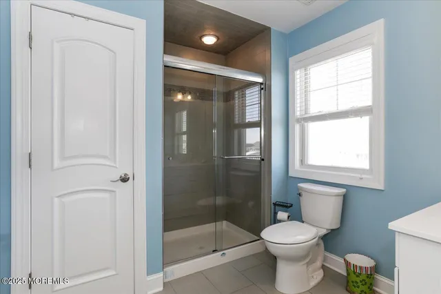 a en suite bathroom with a sink and a mirror