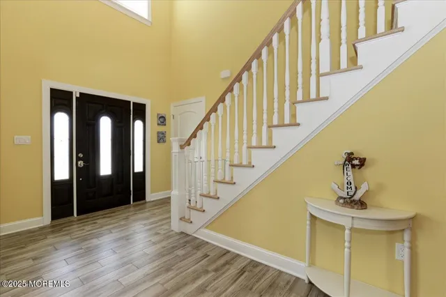 a view of entryway with wooden floor