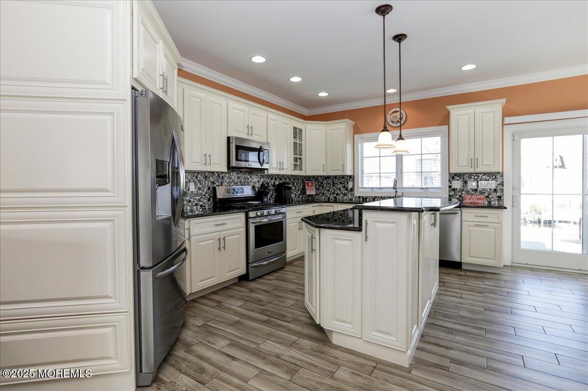 1874 Compass Court Toms River, NJ 08753 - Photo 5 of 12 a kitchen with white cabinets and appliances