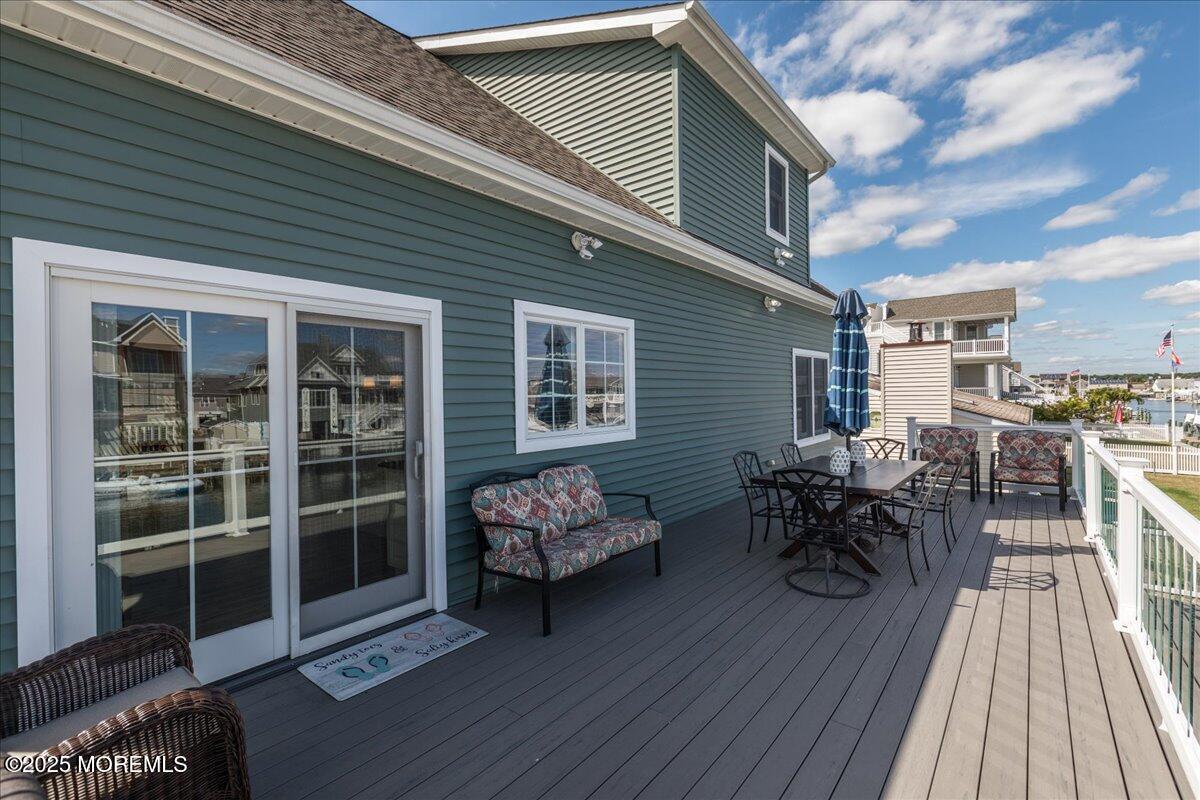 1874 Compass Court Toms River, NJ 08753 - Photo 8 of 12 a backyard of a house with wooden floor and outdoor seating