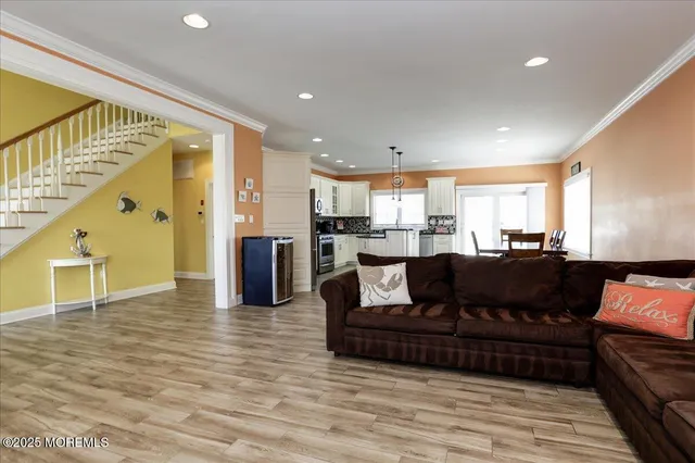 a kitchen with granite countertop a refrigerator stove top oven and sink