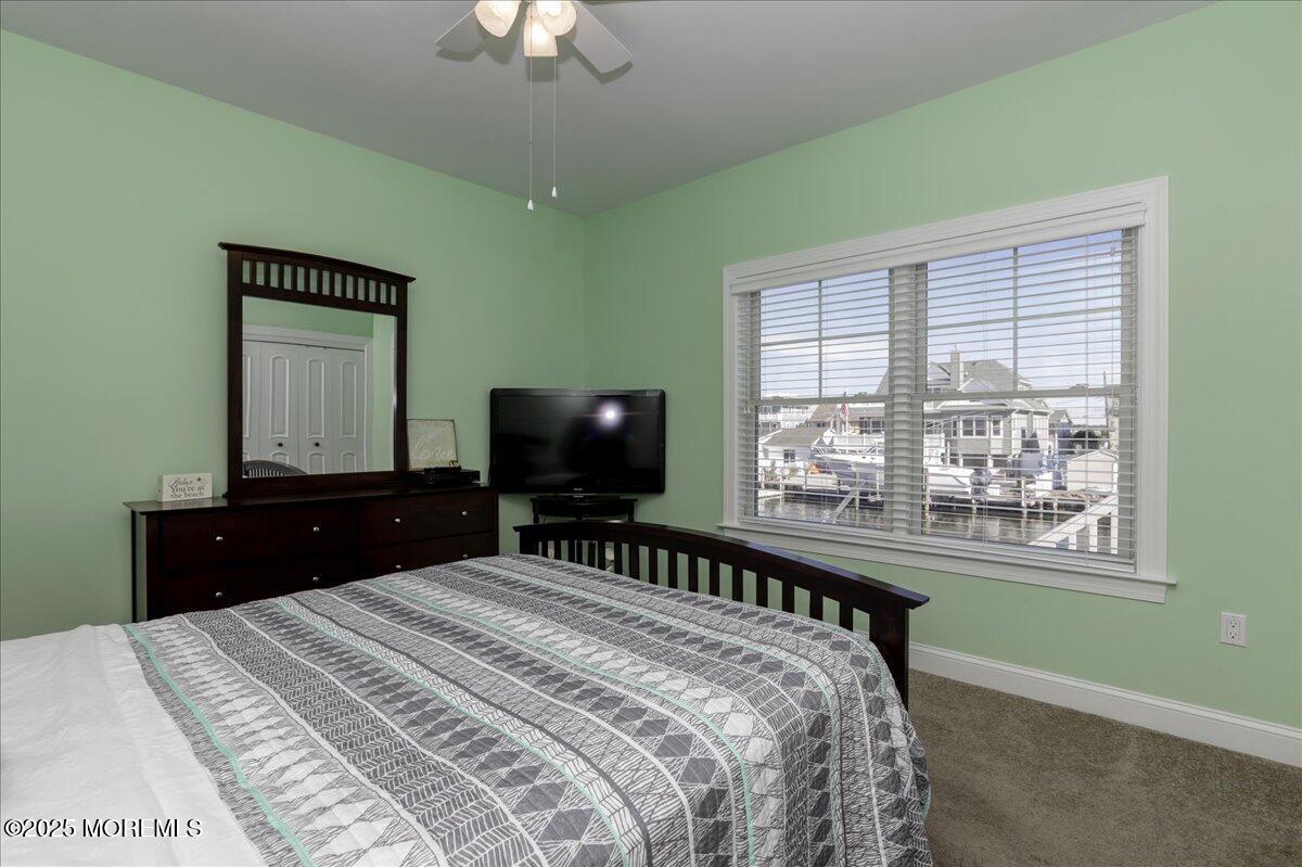 1874 Compass Court Toms River, NJ 08753 - Photo 10 of 12 a bedroom with a bed and a large window