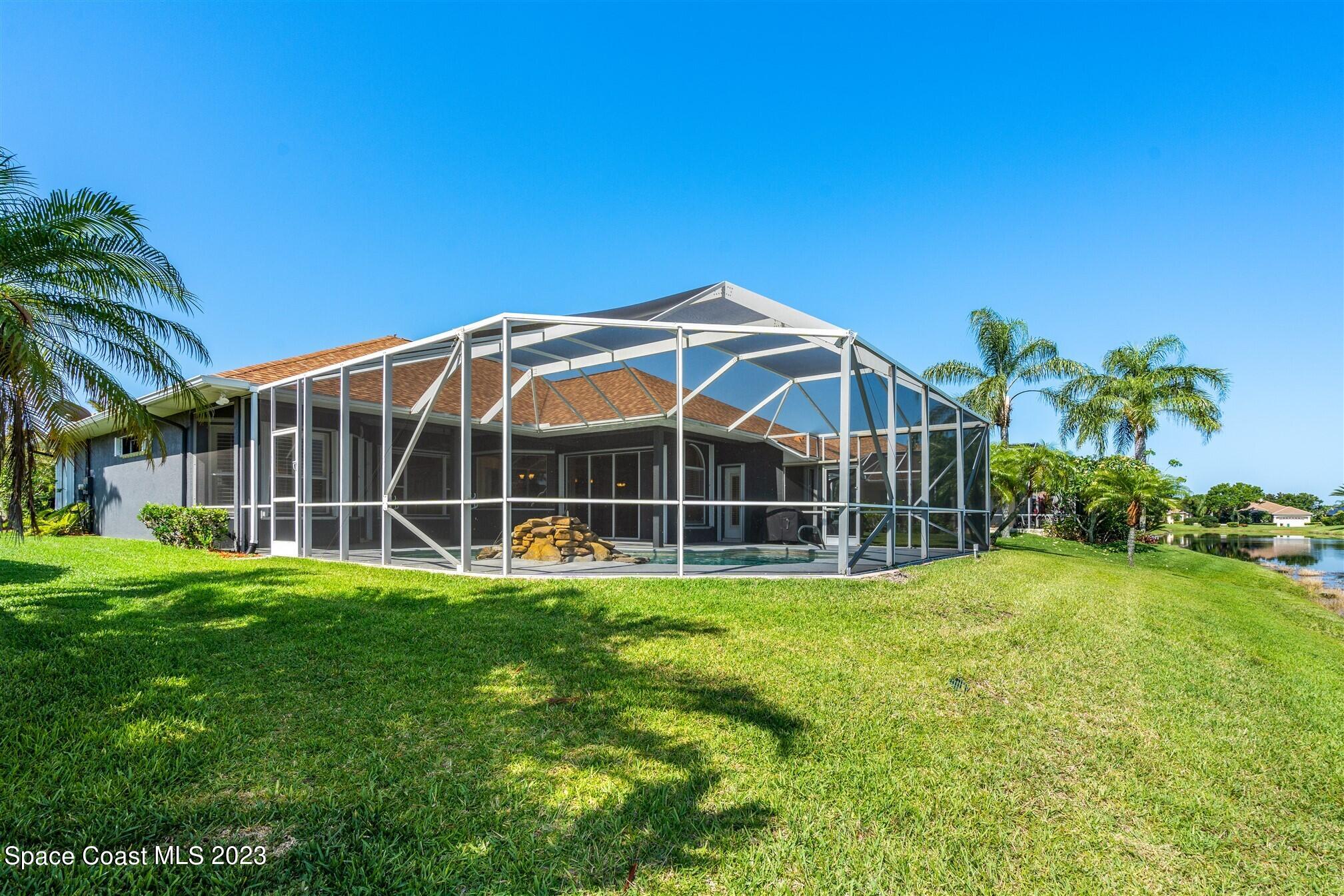 4321 Stoney Point Road Melbourne, FL 32940 - Photo 56 of 73 a view of a house with a yard and sitting area