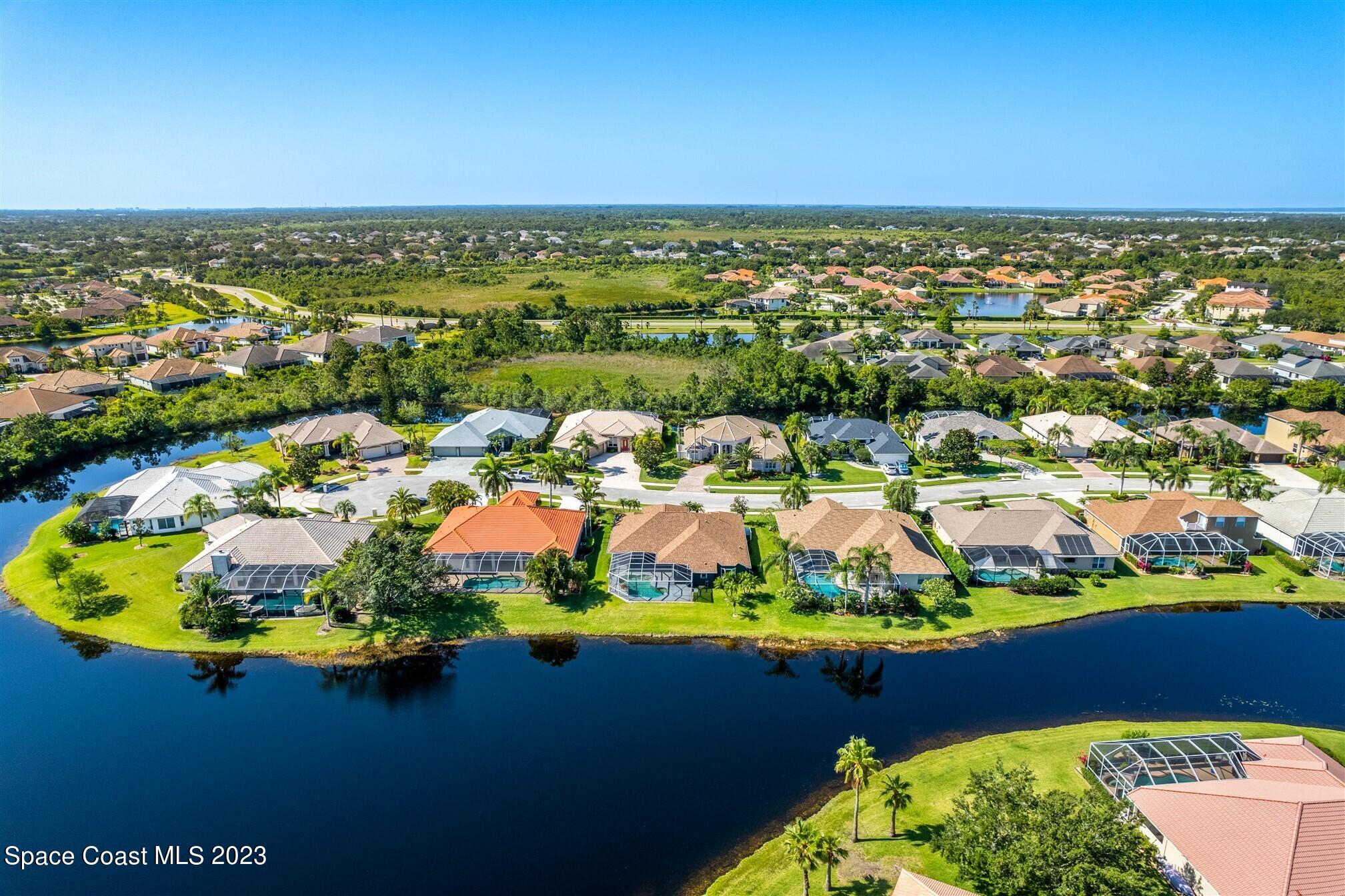 4321 Stoney Point Road Melbourne, FL 32940 - Photo 69 of 73 an aerial view of residential houses with outdoor space