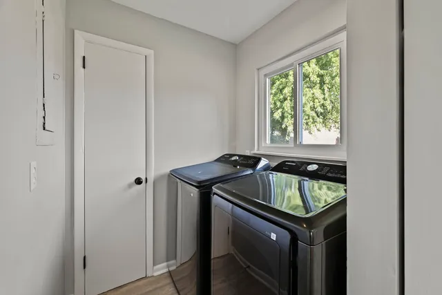 a utility room with closet and window