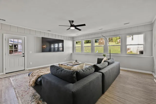 a living room with furniture and a window