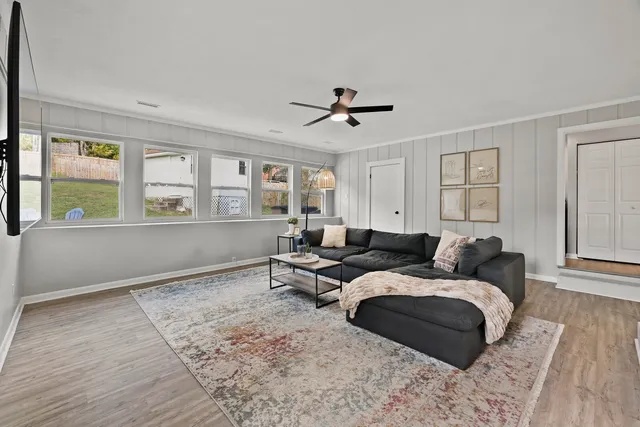 a living room with furniture and a window