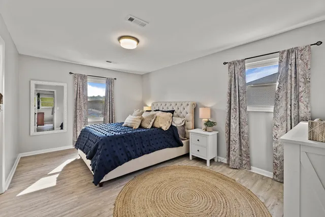 a bedroom with a bed and window