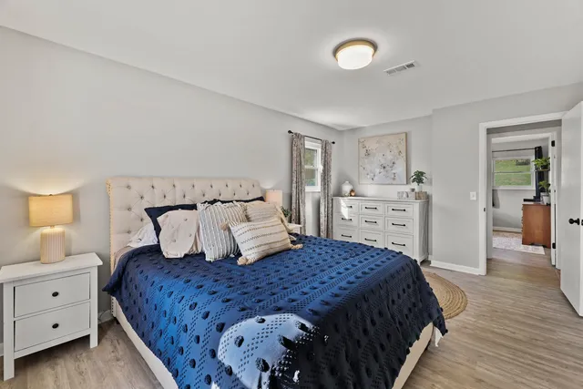 a bedroom with a large bed and a closet