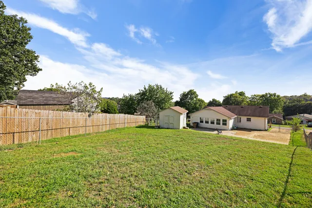 a view of a backyard with houses