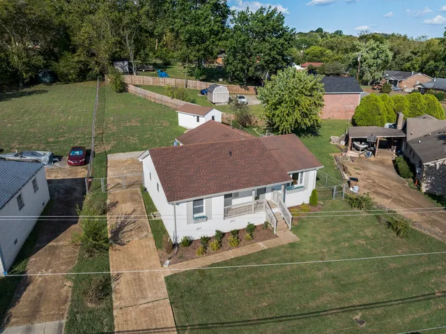 a view of a patio with lawn chairs floor to ceiling window and outdoor space