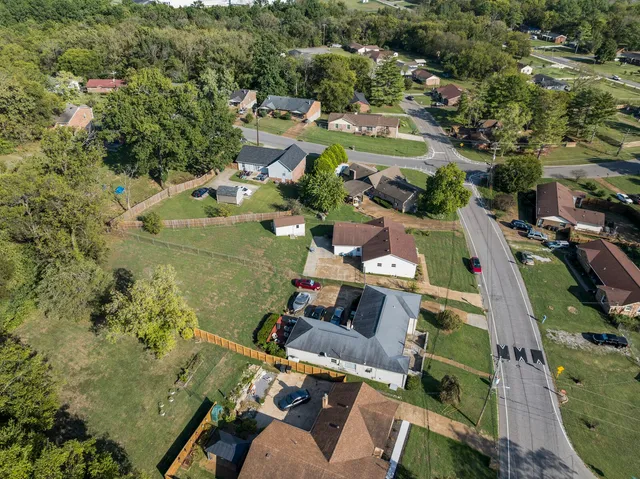 an aerial view of a house with a garden